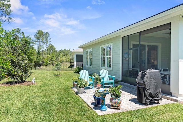 view of yard with fence and a patio