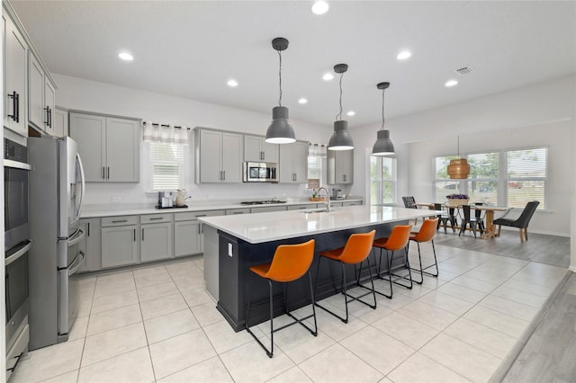 159 Linsbury Ct, Saint Augustine, FL 32092 - kitchen featuring gray cabinetry, appliances with stainless steel finishes, light countertops, plenty of natural light, and recessed lighting