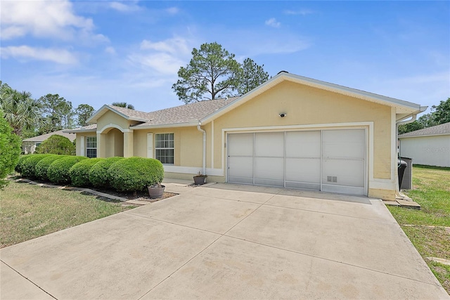 9 Pittman Dr, Palm Coast, FL 32164 - ranch-style home featuring stucco siding, driveway, roof with shingles, and a garage