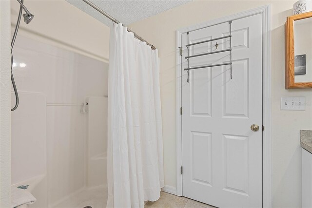 9 Pittman Dr, Palm Coast, FL 32164 - full bathroom featuring tile patterned floors, a shower with shower curtain, and a textured ceiling