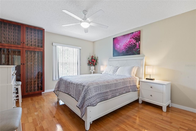 9 Pittman Dr, Palm Coast, FL 32164 - bedroom with light wood-style flooring, baseboards, and a textured ceiling