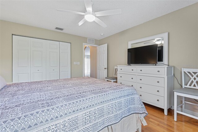 9 Pittman Dr, Palm Coast, FL 32164 - bedroom with a ceiling fan, light wood-style flooring, visible vents, and a closet