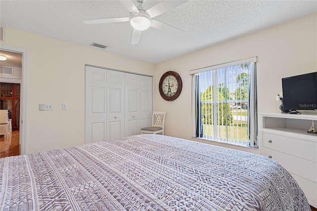9 Pittman Dr, Palm Coast, FL 32164 - bedroom with a textured ceiling, visible vents, a closet, and ceiling fan