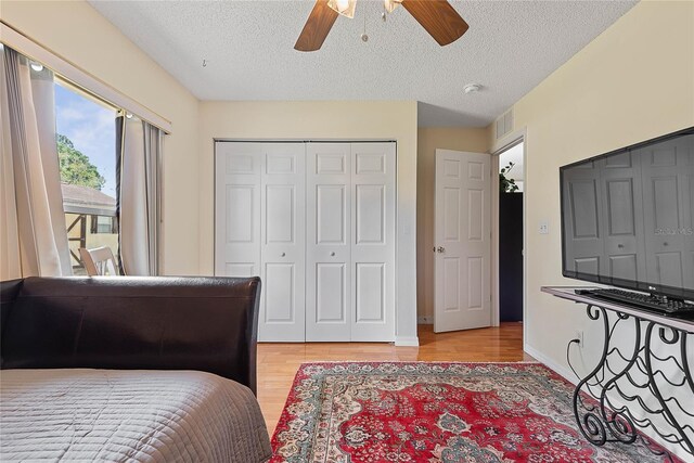 9 Pittman Dr, Palm Coast, FL 32164 - bedroom with a textured ceiling, light wood-style flooring, baseboards, access to outside, and visible vents