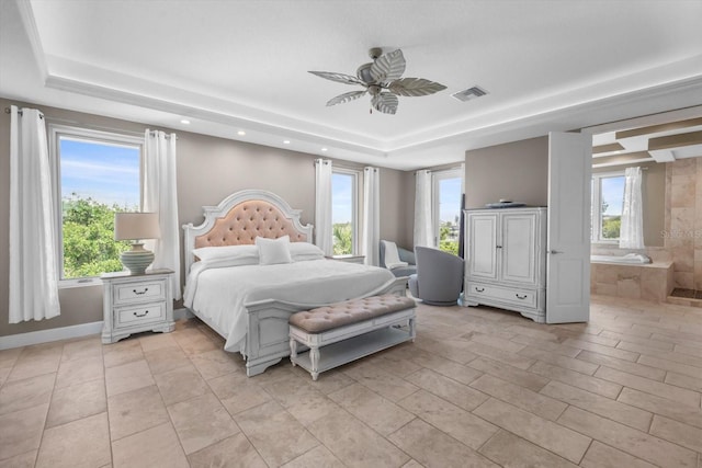 2590 Palm Ave, Flagler Beach, FL 32136 - bedroom featuring a tray ceiling, recessed lighting, light tile patterned floors, a ceiling fan, and ensuite bathroom