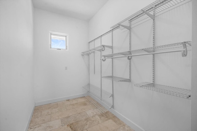 2590 Palm Ave, Flagler Beach, FL 32136 - walk in closet featuring stone finish flooring