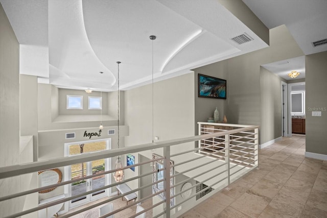 2590 Palm Ave, Flagler Beach, FL 32136 - hallway featuring baseboards and an upstairs landing