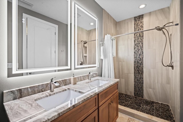 2590 Palm Ave, Flagler Beach, FL 32136 - full bath featuring double vanity, a tile shower, and recessed lighting