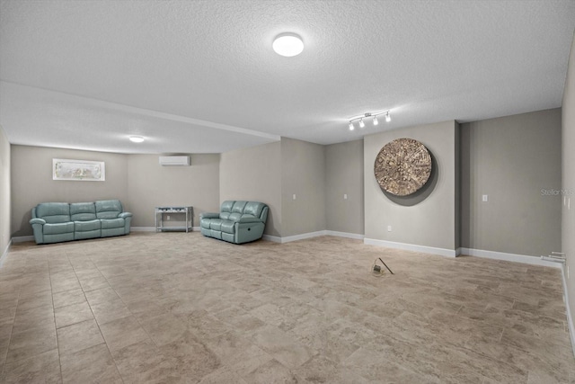 2590 Palm Ave, Flagler Beach, FL 32136 - sitting room with a textured ceiling and a wall mounted AC