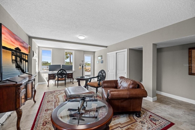 2590 Palm Ave, Flagler Beach, FL 32136 - living area with a textured ceiling and a desk