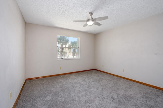 200 Florida Shores Blvd, Daytona Beach, FL 32118 - unfurnished room featuring a ceiling fan, baseboards, carpet, and a textured ceiling