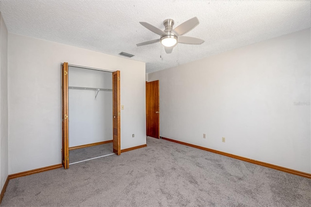 200 Florida Shores Blvd, Daytona Beach, FL 32118 - unfurnished bedroom featuring visible vents, baseboards, carpet, a closet, and ceiling fan