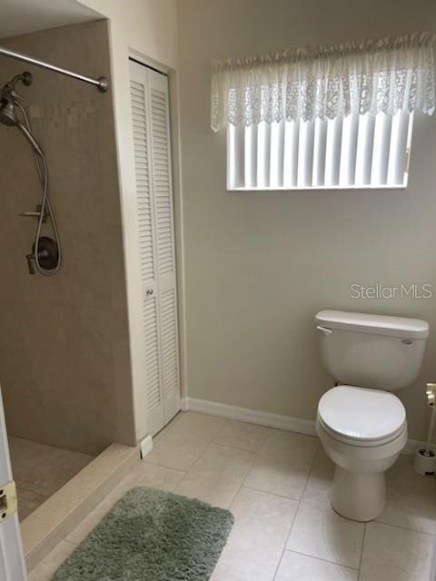 5 Nantucket Dr, Palm Coast, FL 32137 - bathroom with tile patterned flooring, a shower stall, a closet, and toilet
