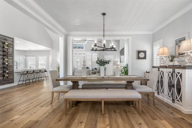 28 Cinnamon Grove Ln, Palm Coast, FL 32137 - dining area with a chandelier, ornamental molding, and wood finished floors