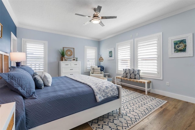 28 Cinnamon Grove Ln, Palm Coast, FL 32137 - bedroom with crown molding, wood finished floors, baseboards, a textured ceiling, and a ceiling fan