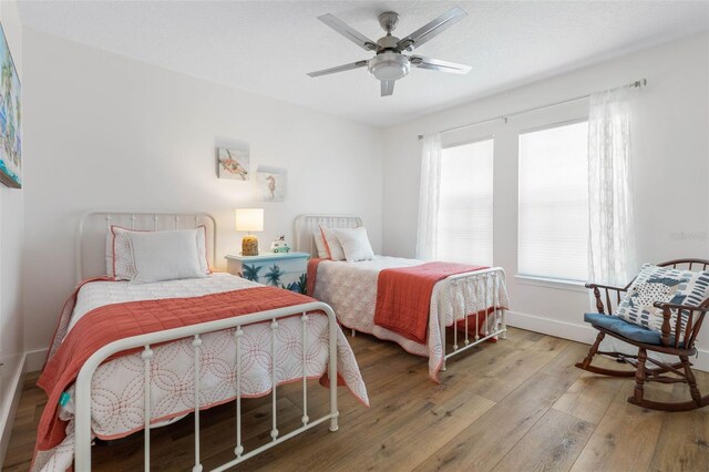 28 Cinnamon Grove Ln, Palm Coast, FL 32137 - bedroom featuring baseboards, ceiling fan, and hardwood / wood-style flooring