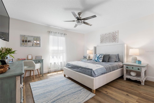 28 Cinnamon Grove Ln, Palm Coast, FL 32137 - bedroom with baseboards, ceiling fan, and wood finished floors