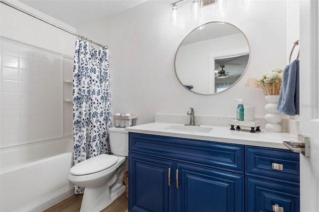 28 Cinnamon Grove Ln, Palm Coast, FL 32137 - full bathroom featuring vanity, toilet, shower / bath combo with shower curtain, a ceiling fan, and wood finished floors