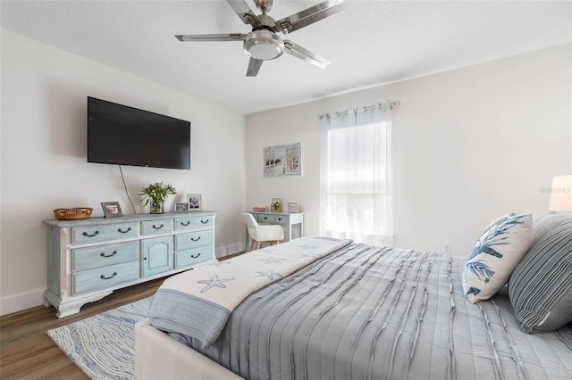 28 Cinnamon Grove Ln, Palm Coast, FL 32137 - bedroom featuring baseboards, a ceiling fan, and wood finished floors