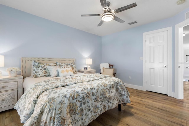 28 Cinnamon Grove Ln, Palm Coast, FL 32137 - bedroom with visible vents, a ceiling fan, baseboards, and wood finished floors