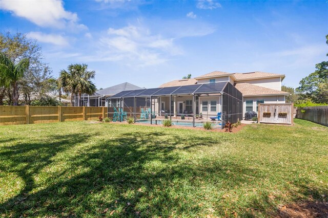 28 Cinnamon Grove Ln, Palm Coast, FL 32137 - rear view of house with a fenced backyard, a fenced in pool, a yard, and a lanai