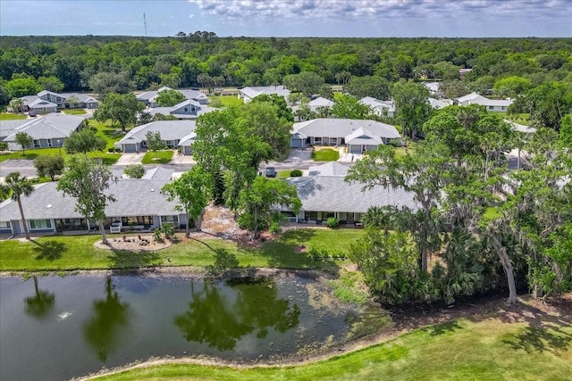 bird's eye view featuring a residential view, a water view, and a forest view
