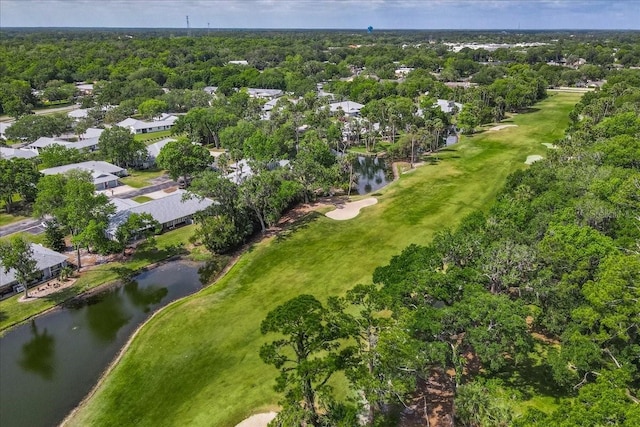 aerial view with view of golf course, a water view, and a residential view