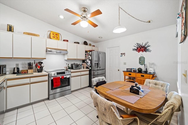 kitchen featuring white cabinets, appliances with stainless steel finishes, light countertops, under cabinet range hood, and a ceiling fan