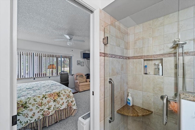 bathroom featuring a stall shower and ceiling fan