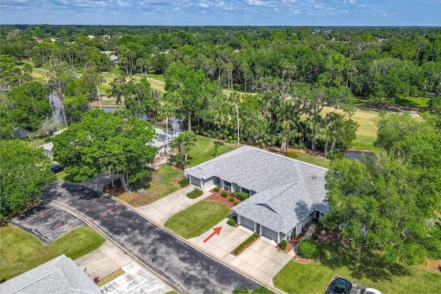 aerial view with a wooded view