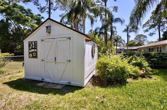 view of shed with fence