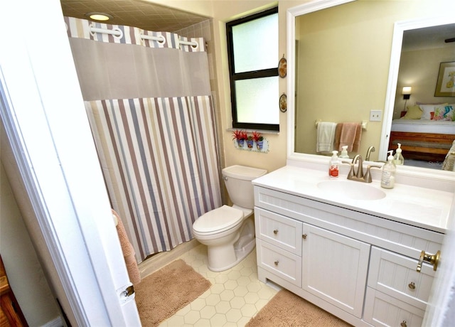 full bathroom featuring toilet, a shower with shower curtain, tile patterned floors, ensuite bathroom, and vanity
