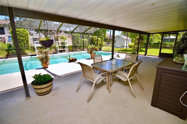 exterior space with a lanai, a patio, and outdoor dining area