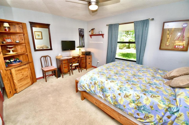 carpeted bedroom with a ceiling fan