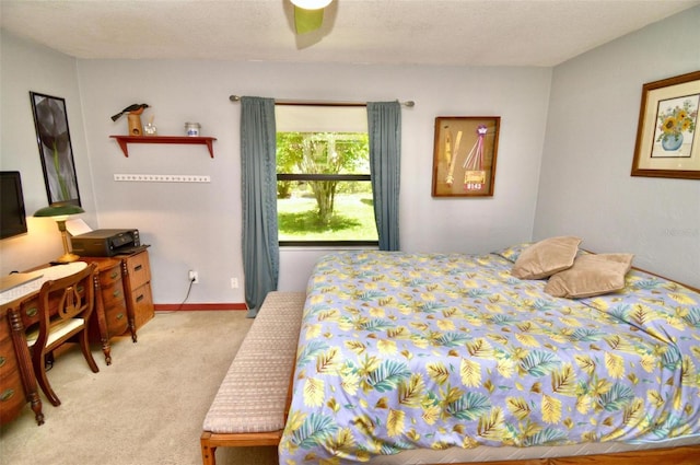 bedroom featuring light carpet