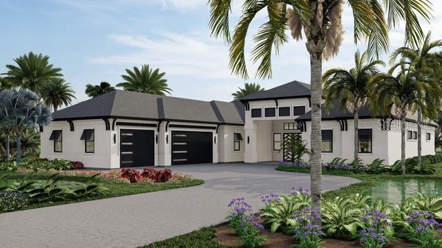 view of front of house with stucco siding, driveway, and a garage