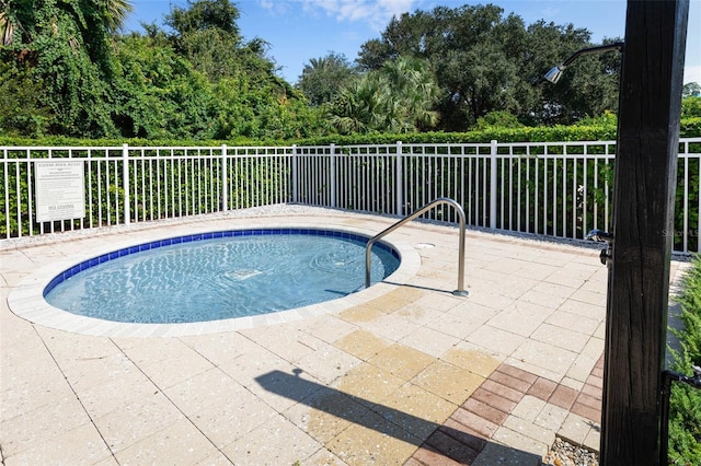 view of pool with fence
