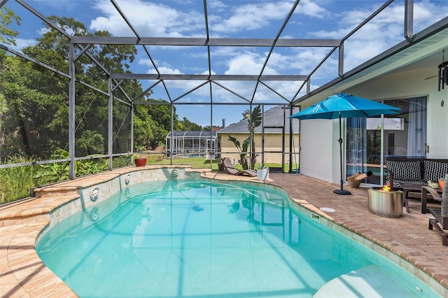 outdoor pool with a patio and glass enclosure