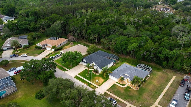 aerial view with a residential view and a view of trees