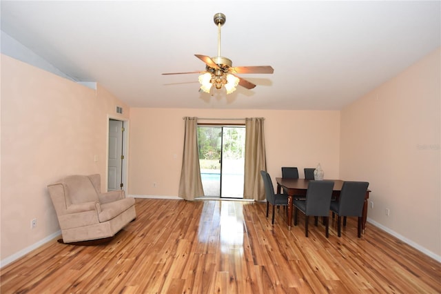 sitting room featuring baseboards, a ceiling fan, and light wood-type flooring