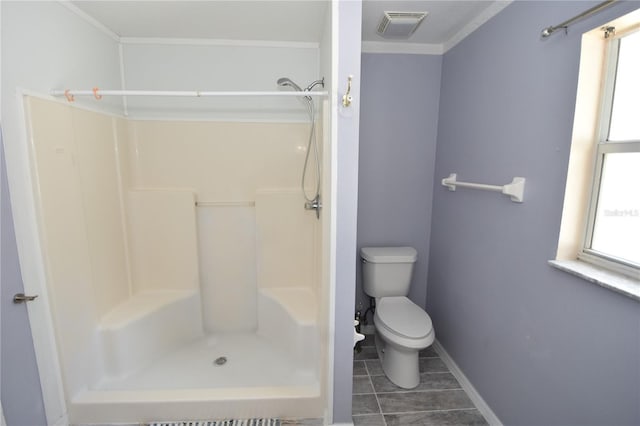 bathroom featuring visible vents, tile patterned flooring, a shower, toilet, and baseboards