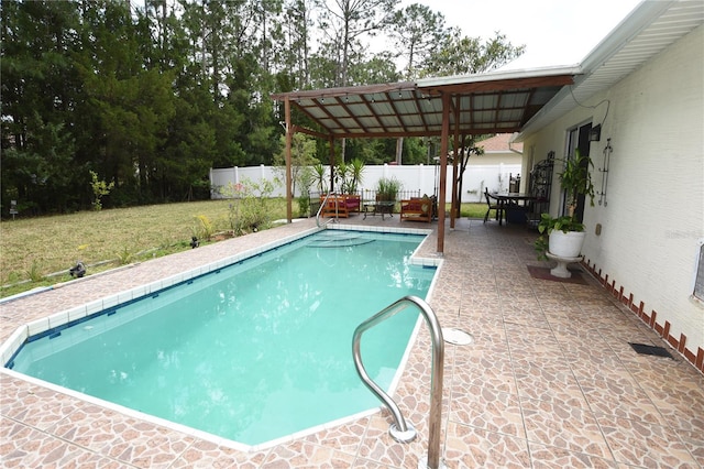 view of pool featuring a yard, fence, a patio area, and a fenced in pool