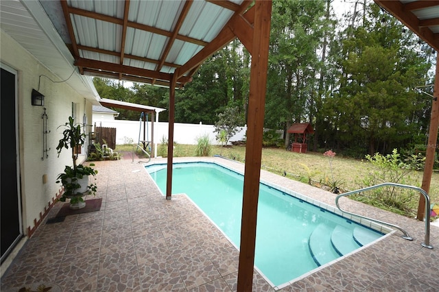 view of swimming pool with a fenced in pool, a fenced backyard, and a patio area