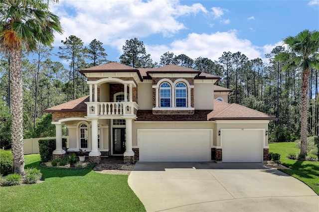45 King Palm Ct, Ponte Vedra, FL 32081 - mediterranean / spanish home featuring stone siding, concrete driveway, a balcony, roof with shingles, and stucco siding