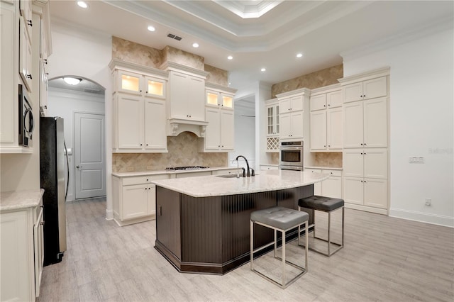 45 King Palm Ct, Ponte Vedra, FL 32081 - kitchen with stainless steel appliances, ornamental molding, recessed lighting, a breakfast bar area, and a sink