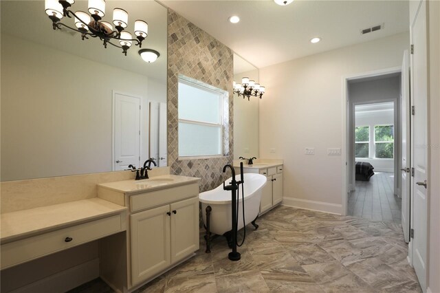 45 King Palm Ct, Ponte Vedra, FL 32081 - full bathroom featuring a chandelier, vanity, a freestanding bath, baseboards, and recessed lighting
