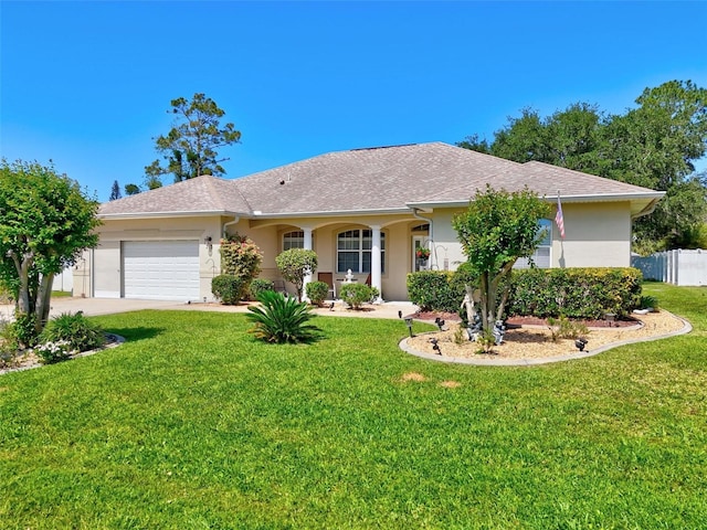 ranch-style house with driveway, a front yard, a garage, a shingled roof, and stucco siding