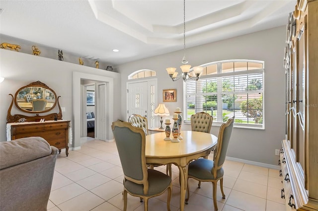 dining room with a raised ceiling, baseboards, a chandelier, recessed lighting, and light tile patterned flooring