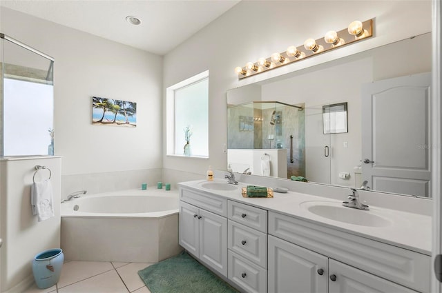 bathroom featuring a sink, double vanity, tile patterned floors, a shower stall, and a bath