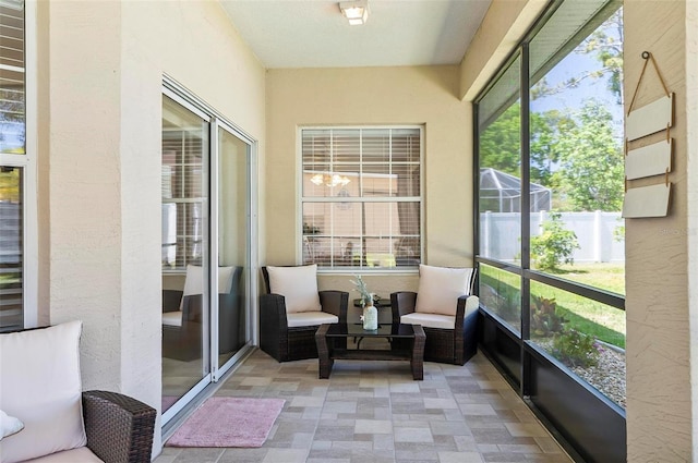 sunroom / solarium featuring a healthy amount of sunlight